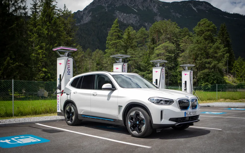 Electric SUV at a highway DC fast-charging station